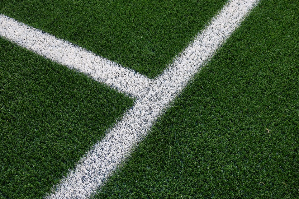 artificial turf football field installation